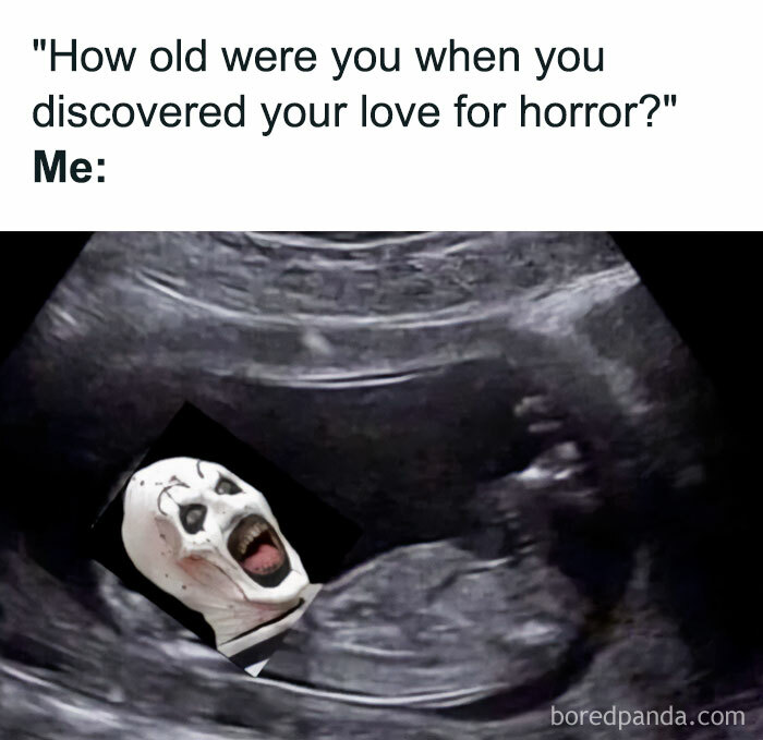 A Halloween meme featuring an ultrasound image with a horror clown edited into it. The caption above reads, "'How old were you when you discovered your love for horror?' Me:" humorously suggesting a lifelong love for horror starting in the womb.