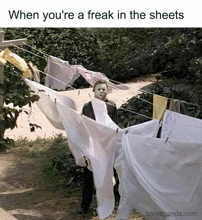 A Halloween meme featuring a character wearing a Michael Myers mask standing among clotheslines with hanging sheets. The caption above reads, "When you're a freak in the sheets," humorously playing on the double meaning of "sheets" and the eerie scene from a horror movie.