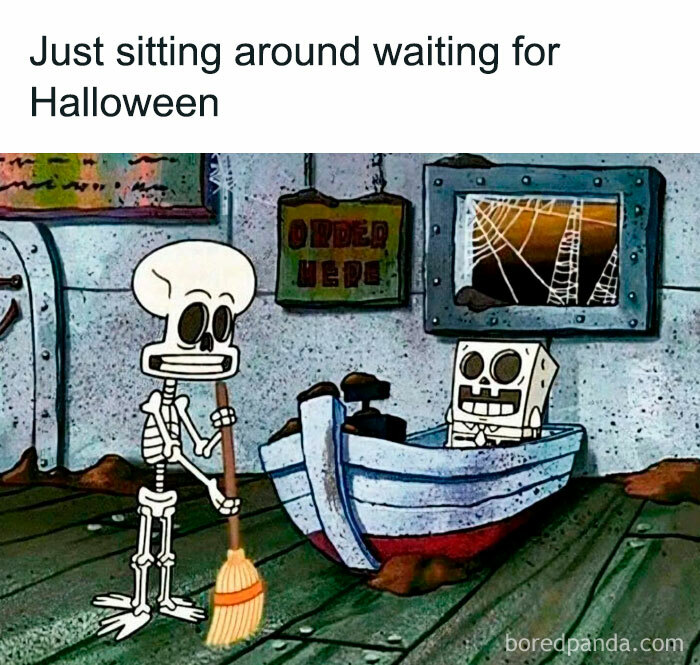 A Halloween meme featuring two skeleton characters in a restaurant setting. One skeleton is sweeping the floor while the other is sitting at a counter. Cobwebs and a sign that reads "Order Here" are in the background. The text above the image reads, "Just sitting around waiting for Halloween."