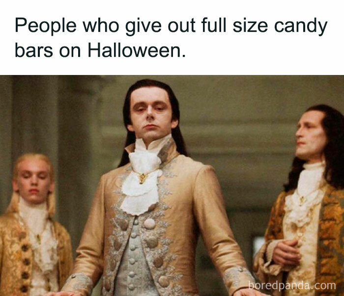 A Halloween meme featuring a group of aristocratic figures in fancy period clothing. The text above reads, "People who give out full size candy bars on Halloween."