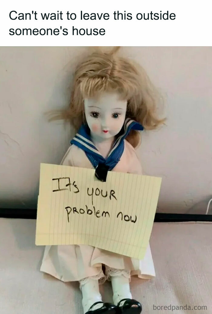 A Halloween meme featuring a creepy old doll with messy hair, holding a sign that says, "It's YOUR problem now." The caption above reads, "Can't wait to leave this outside someone's house," humorously implying a spooky prank.