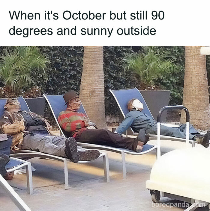 An October meme showing horror movie characters lounging on pool chairs in the sun. Text above reads, "When it's October but still 90 degrees and sunny outside."