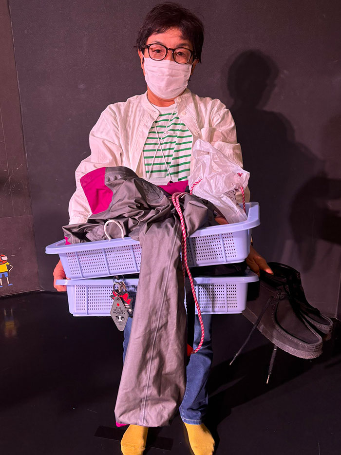 Person Standing In Line At The Security Checkpoint Of An Airport