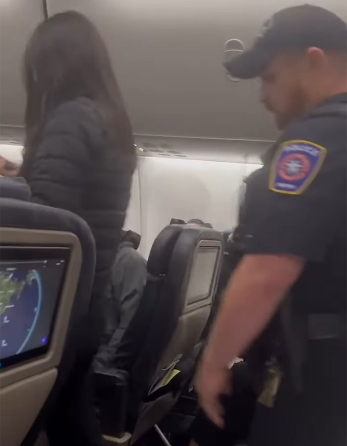 Hilarious Theme Song Accompanies Racist Woman As She’s Removed From Flight