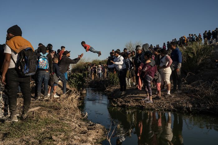 Documentary & Photojournalism, Remarkable Artwork: A Migrant Child Tossed Over The Border By Go Nakamura