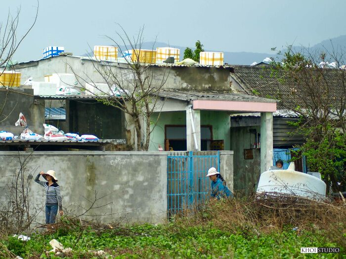 Styrofoam Boxes Are Placed On The Roof, Then Filled With Water To Increase The Weight, To Keep The Corrugated Iron Roof From Being Blown Away By Strong Winds