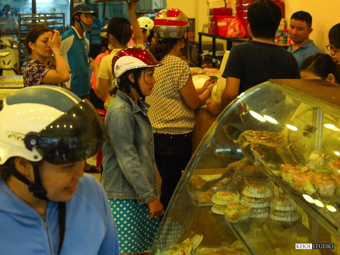 The Bread Shop Was Crowded With People Buying Food