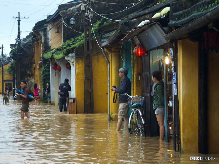 Tourists Visit Hoi An Ancient Town - "The Yellow City Of Vietnam" On A Flood Day