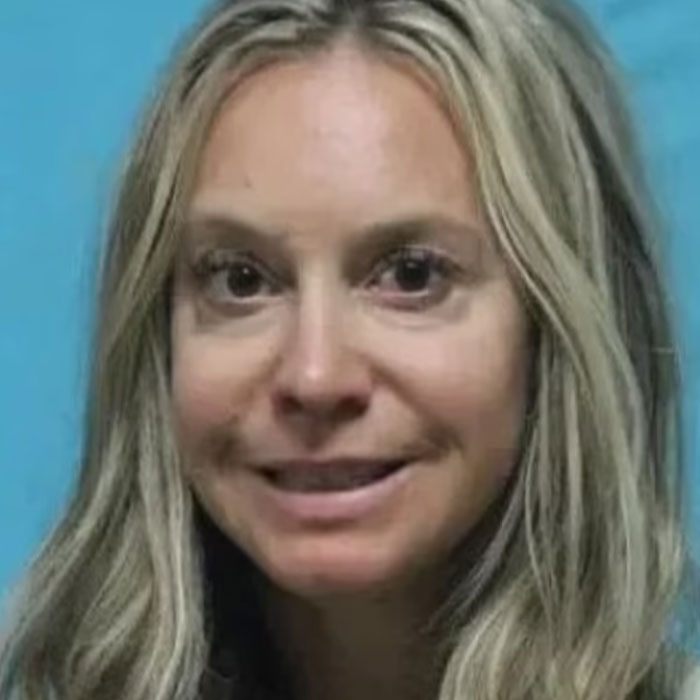 "Lock Her Up": Teacher Grins In Mugshot After Physical "Affair" With 15YO Boy Lands Her In Jail