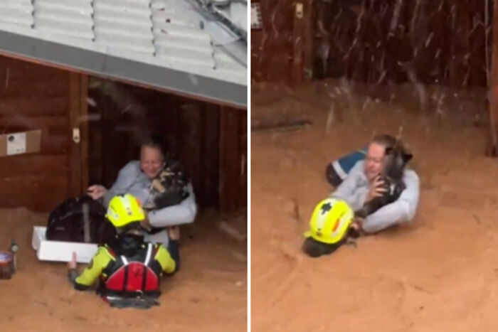 Brave Woman Holds On To Her Dog In Neck-Deep Floodwater As They Wait For Rescue Helicopter