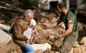 Brave Woman Holds On To Her Dog In Neck-Deep Floodwater As They Wait For Rescue Helicopter