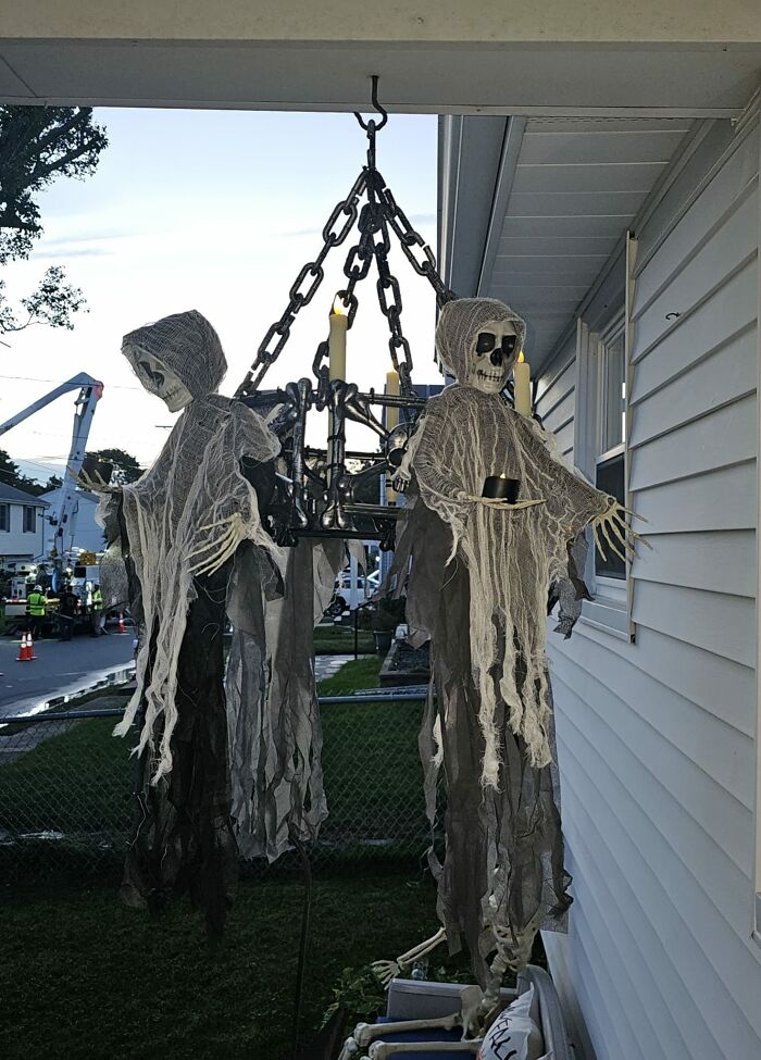 Thought I'd Share The Creepy Chandelier I Made, The Pic Doesn't Do It Justice Because You Can't Really See The Lights But They Are Remote Controlled Candle Sticks And Each Skeleton Is Holding A Tea Light