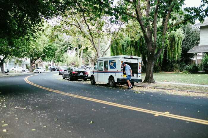 Mailman Finds A Hilarious Way To Greet Beloved Dog Each Morning On His Route