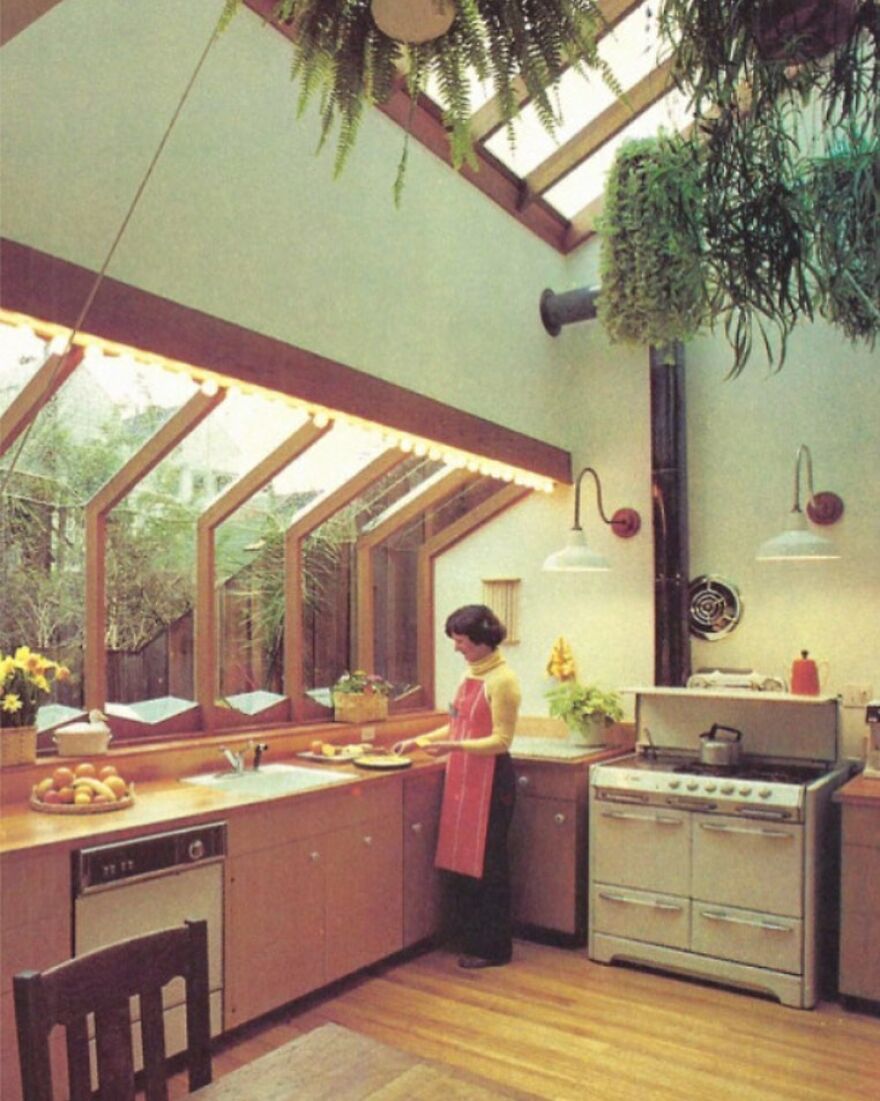 A 1980s Kitchen With Skylights And The Cook In Action