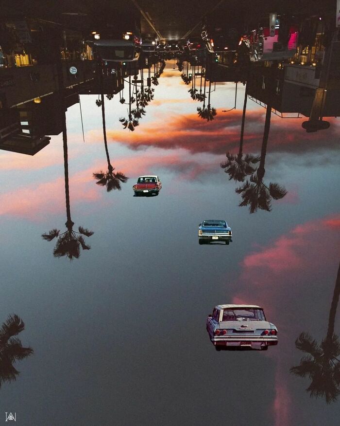 Surrealism-inspired art with vintage cars driving on clouds, reflecting a cityscape with palm trees.