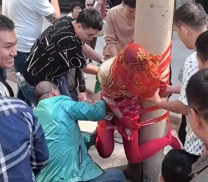 Bride Taped To Phone Pole Sparks Heated Debate Over Wedding Hazing Customs