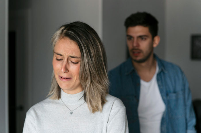 Man and woman arguing in a tense situation related to affair forgiveness.