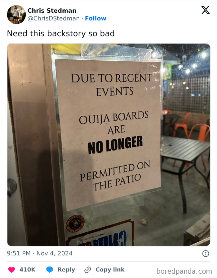 Sign on a restaurant door humorously banning Ouija boards, highlighting funny tweets online in November.