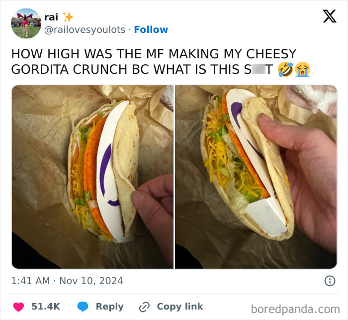 Close-up of a taco humorously filled with a cardboard divider alongside actual toppings, capturing a funny-tweet moment.