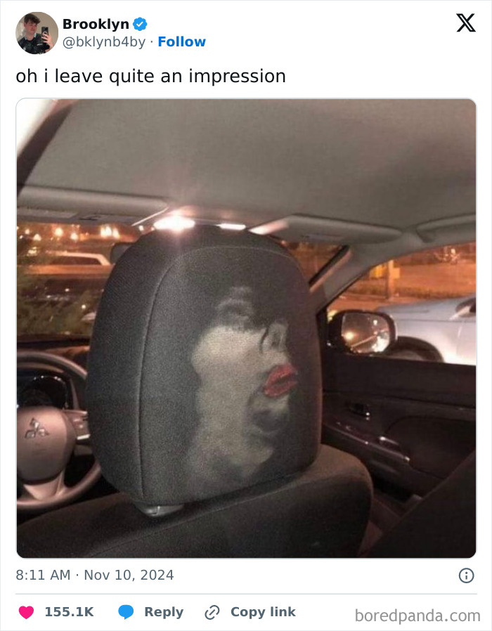 Car seat with a funny face imprint seen online in November tweet.