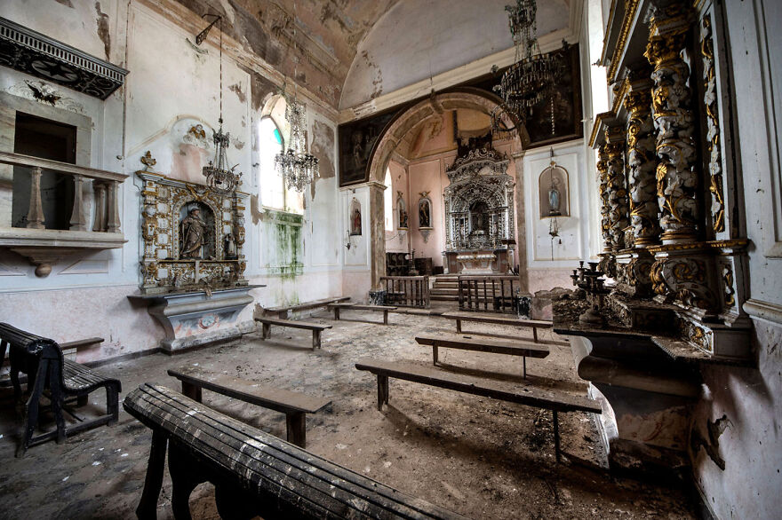 Abandoned sacred place in Europe, featuring decaying pews, ornate altars, and faded walls, creating a hauntingly beautiful scene.