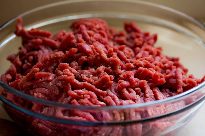 Bowl of raw ground meat, related to vegetarian mom concerned about family feeding baby meat.