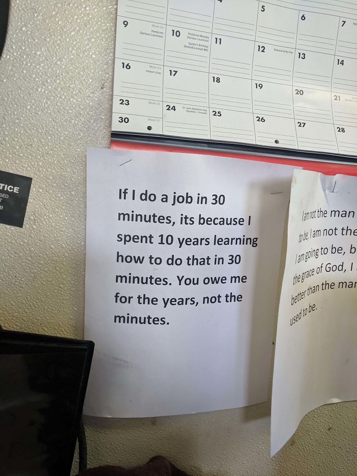 Printed note on wall highlighting a harsh reality check about valuing time and expertise over minutes spent.