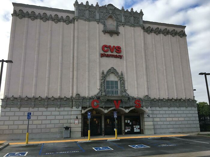 Historic building conversion into a CVS Pharmacy, showcasing ornate architectural details.