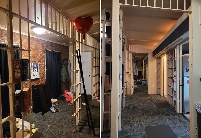 Hallway of a building conversion with exposed brick walls and modern decor.