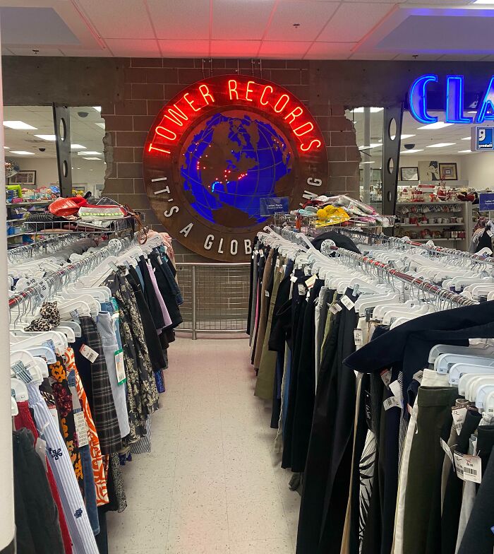 Thrift store with Tower Records sign, showcasing an example of the best building conversions.