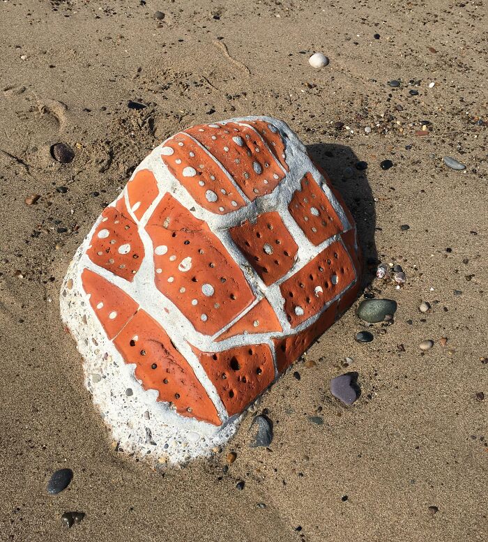 A Pile Of Bricks Left On The Beach