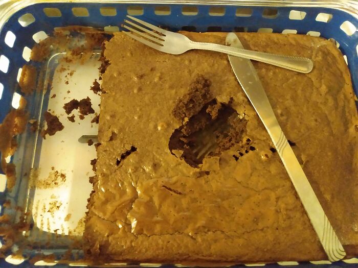 Half-eaten brownie with a fork and knife placed on top, showcasing infuriating boyfriend or husband behavior.