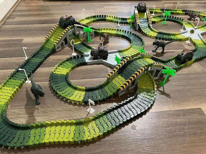 Roar Into The World Of Prehistoric Racing With The Dino World Race Track, An Action-Packed Playset That Lets Kids Create Their Own Dino-Mite Adventures