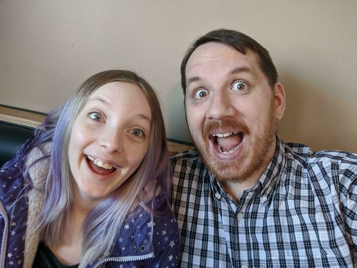 A happy father and daughter smiling, exemplifying a wholesome adoption story.