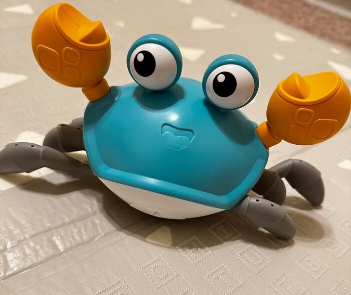 Delight Little Ones With The Crawling Crab Baby Toy, A Colorful And Interactive Playmate That Moves And Crawls Across The Floor, Providing Endless Entertainment And Stimulation For Developing Babies And Toddlers