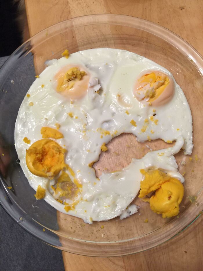 Messed-up attempt at frying eggs, highlighting infuriating kitchen moments caused by boyfriends and husbands.