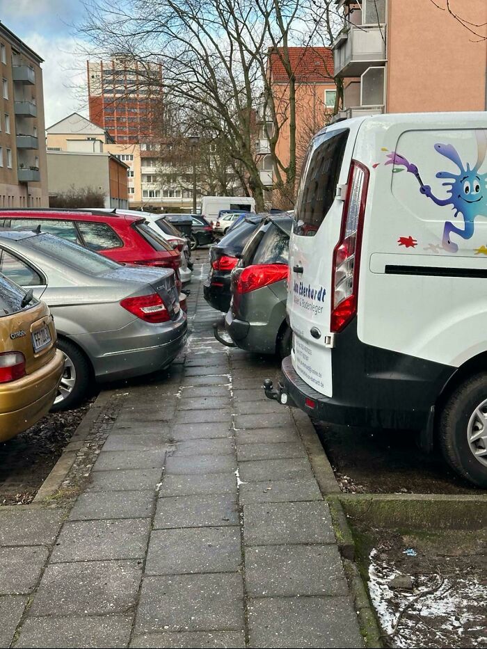 “Footpath” In Germany. No This Is No Parking Lot But A Sidewalk - No There Is No 2nd Sidewalk Or Safe Alternative But The Street