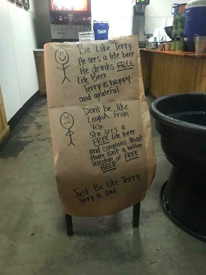 Sign about choosing beggars: "Be like Terry, happy with free beer. Don't be like Leigh A., who complains about free beer variety."