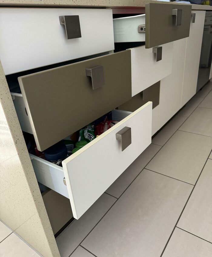 Kitchen drawers left open, showing contents, a common source of frustration in relationships.