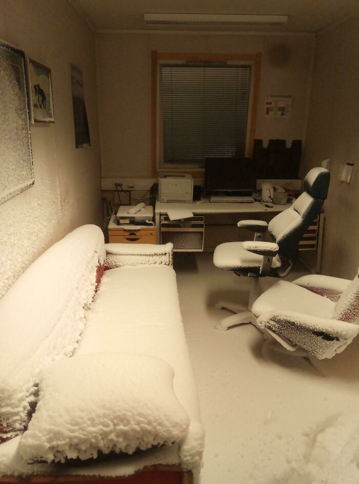 A frosty office interior covered in snow, showcasing a unique ice-cold winter scene.