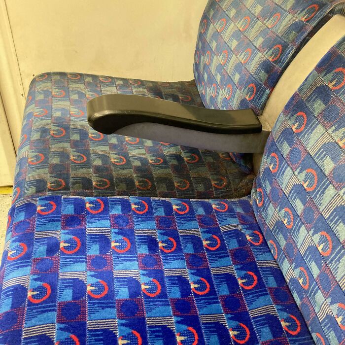 "Before after cleaning pictures of a train seat, one half clean and vibrant, the other half dull and dirty."