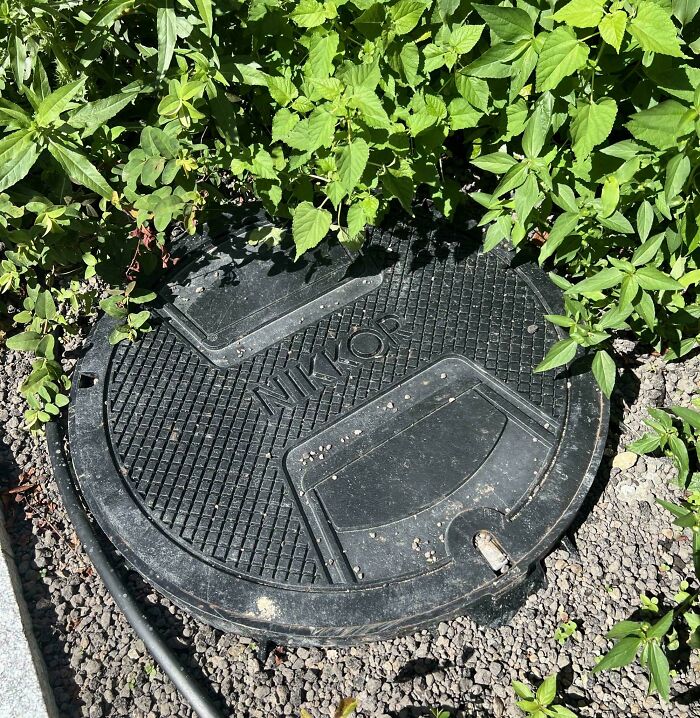 Manhole Cover At Nikon's New Headquarters That Looks Like Nikon's Front Lens Cap