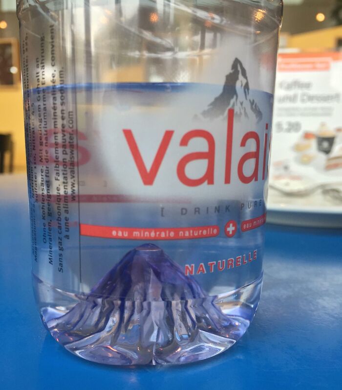 This Swiss Water Bottle Has A The Shape Of A Mountain Inside The Bottle