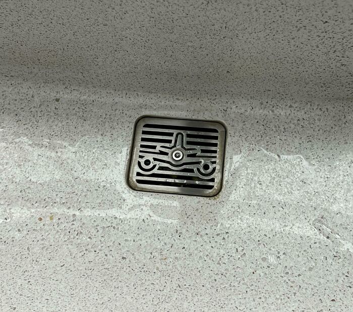 Sink Drain At An Airport Shaped Like An Airplane