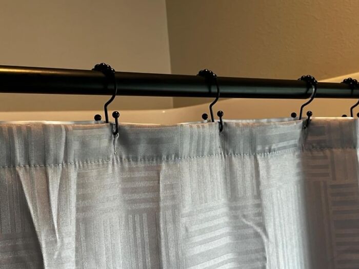 Tired Of Your Shower Curtain Putting Up A Fight Every Morning? These Shower Curtain Hooks Rings Will Have Your Curtain Gliding Effortlessly, Even If You're Half Asleep