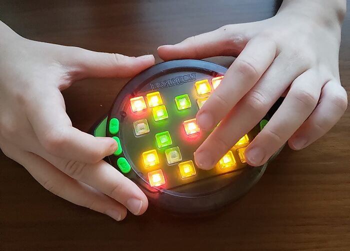 This Handheld Electronic Memory Game Is A Blast From The Past, But With A Futuristic Twist! It's The Classic Memory Game You Loved As A Kid, Now Packed With Lights, Sounds, And Challenging Levels That Will Put Your Memory To The Test