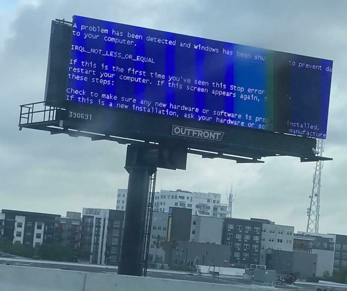 Billboard displaying a Windows error message, illustrating a humorous advertising fail.