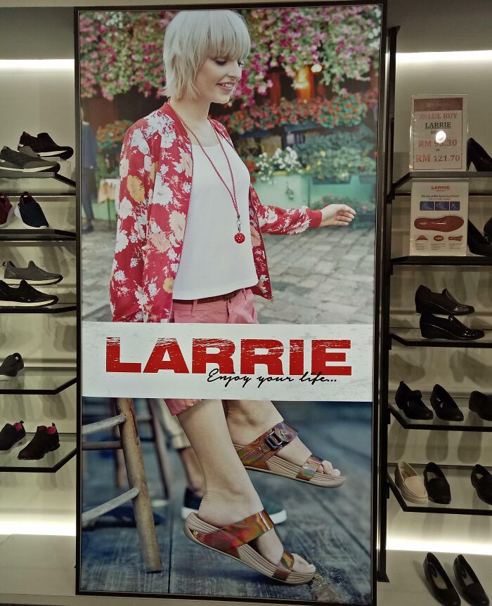 Store display featuring a woman in sandals with cut-off text, a humorous example of funny ad fails.