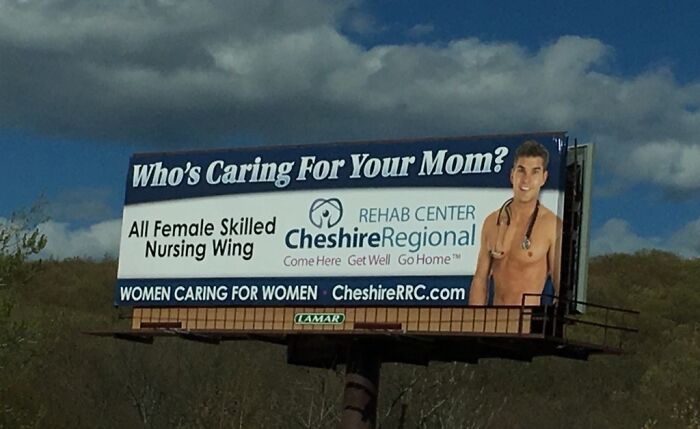 Billboard showing a man with stethoscope for all-female nursing wing; humorous ad fail.