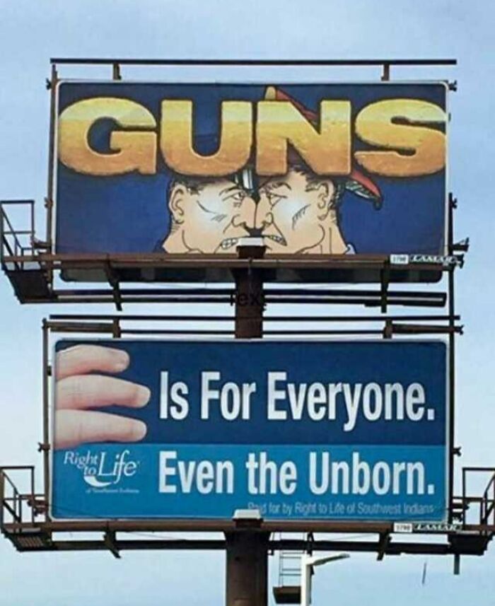 Billboard showing a funny ad fail with contrasting messages about guns and life rights.